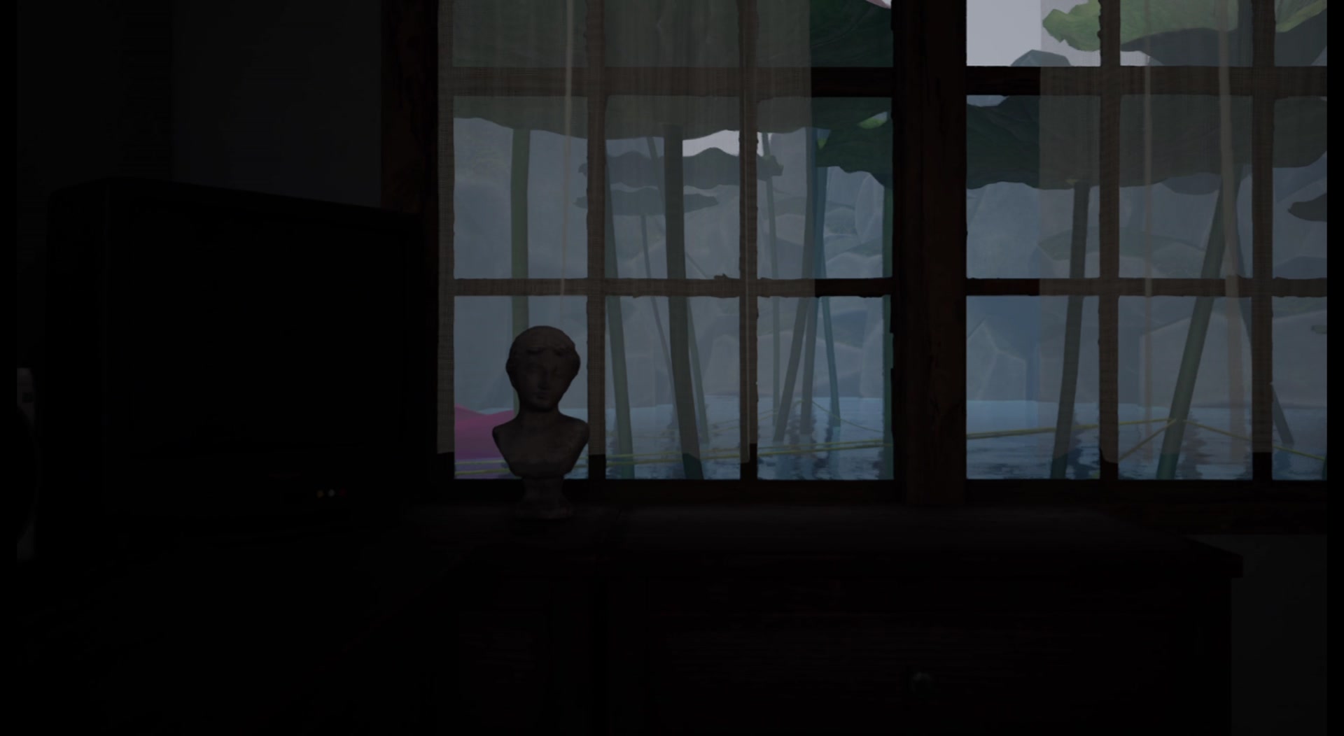 Dimly lit room with a window overlooking the lotus landscape